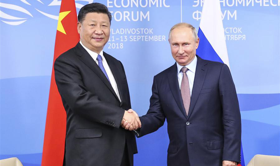 Xi, Putin vow to promote ties regardless of global changes