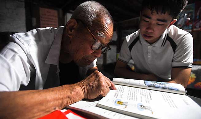 92-year-old rural teacher tutors children left behind by migrant parents free of charge in China's Hunan