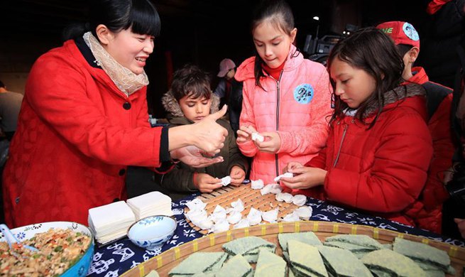 Foreigners attend activity featuring Chinese Lunar New Year customs in China's Zhejiang