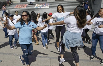 Migrant workers, supporters participate in flash mob dance in Vancouver