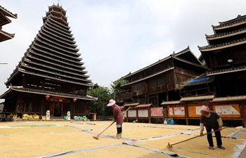 Villagers air grain in south China's Guangxi